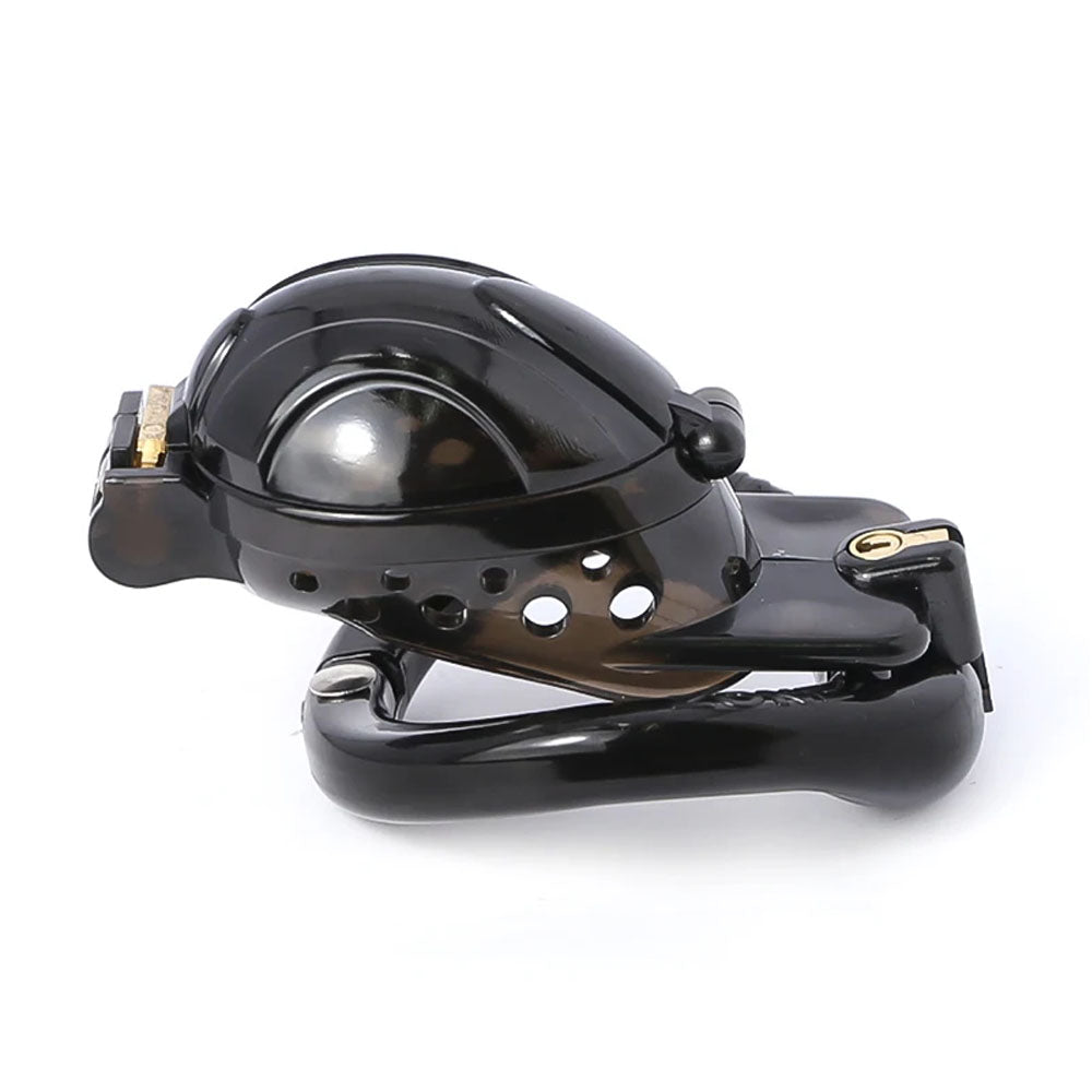 Tired of negative experiences with ill-fitting devices? The Lock, Stock, And cage is a ball-trap device that securely traps without the need for piercing. Its adjustable chastity rings prevent testical slippage, ensuring your Sub stays locked and comfy!