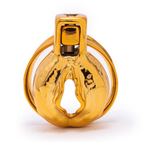 Experience luxury and control with the Golden Clitty Short cage. Under your mistress's watchful eye, this stylish device keeps your clitty secure, turning negative impulses into positive restraint even in bed. Embrace a new level of intimacy.