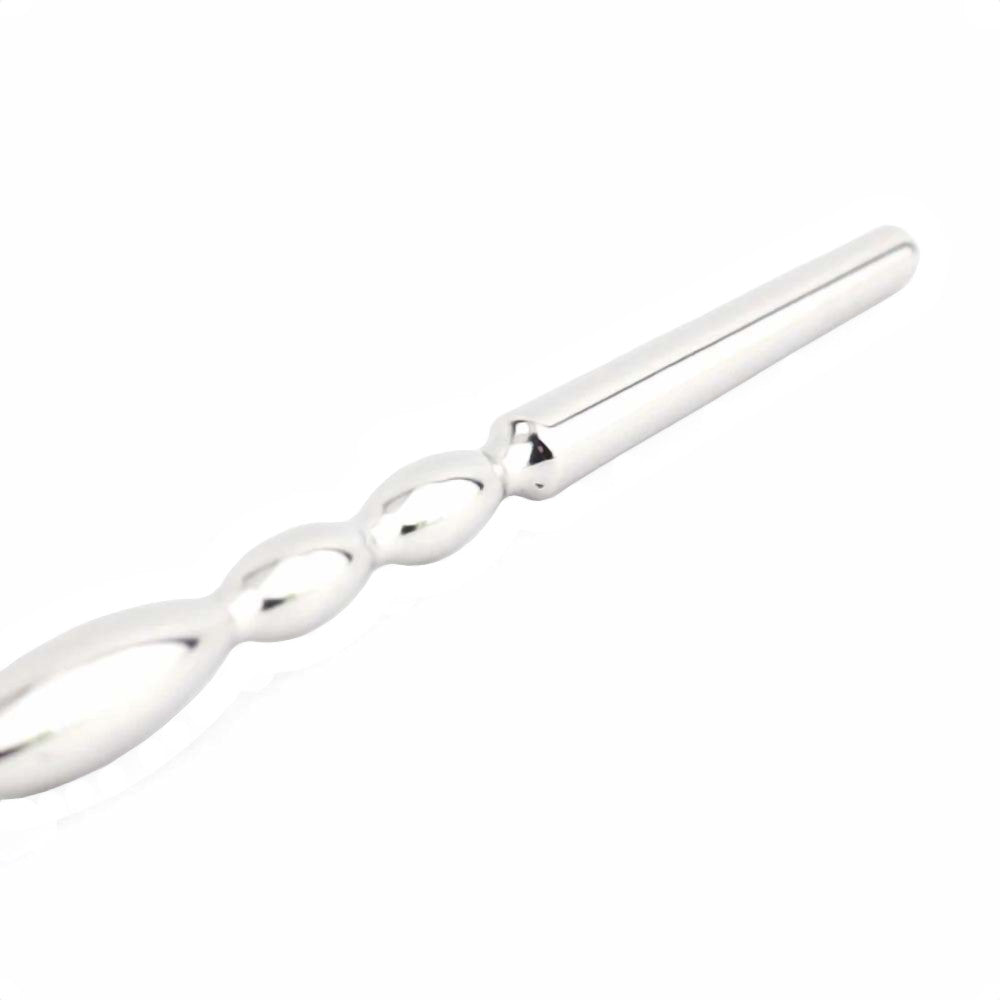Experience unprecedented urethral pleasure with our wide, smooth, insertable rod. This chastity device penis plug enhances your sounding cock adventures, featuring a loop handle like a string for safe and easy control. Perfect for both beginners and enthusiasts.